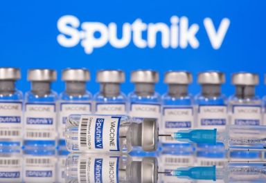 Vials labelled “Sputnik V Coronavirus COVID-19 Vaccine” and a syringe