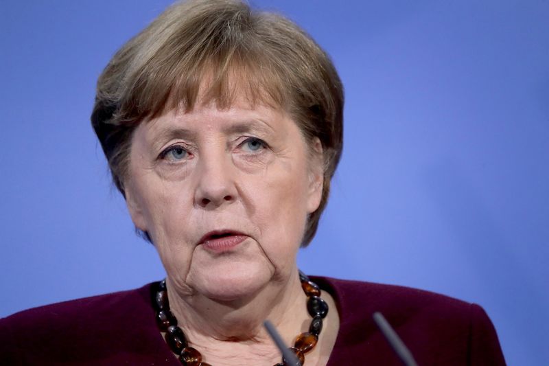 German Chancellor Angela Merkel addresses the media during a news