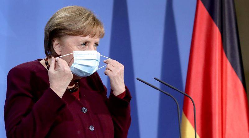 German Chancellor Angela Merkel arrives for a news conference, in