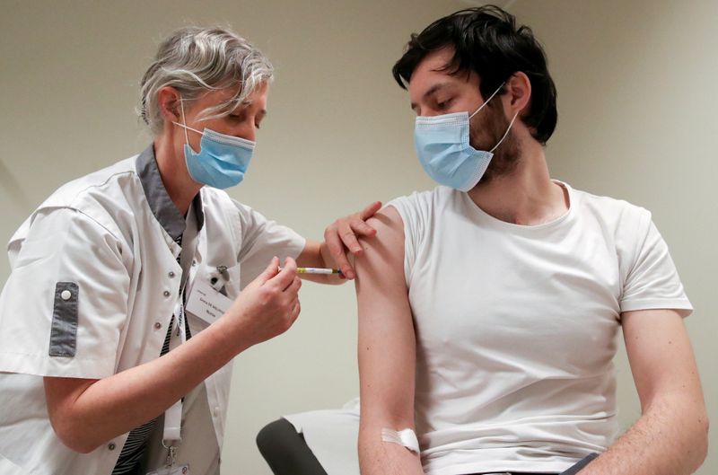 FILE PHOTO: A volunteer receives a dose of CureVac vaccine