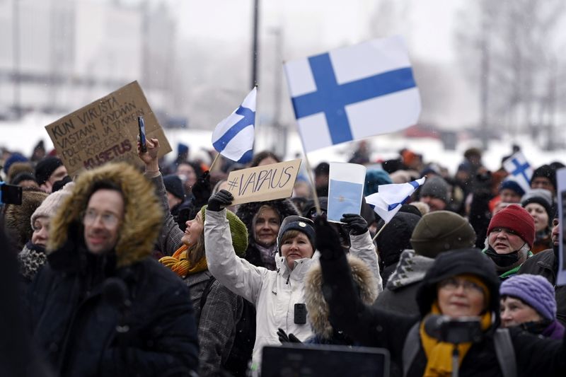 FILE PHOTO: People protest against Finnish government’s regulations to fight
