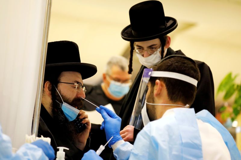 FILE PHOTO: Passengers get tested for COVID-1 at Ben Gurion