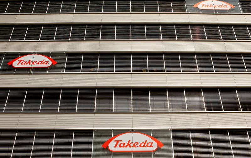 Logos of Japanese Takeda Pharmaceutical Co are seen at an