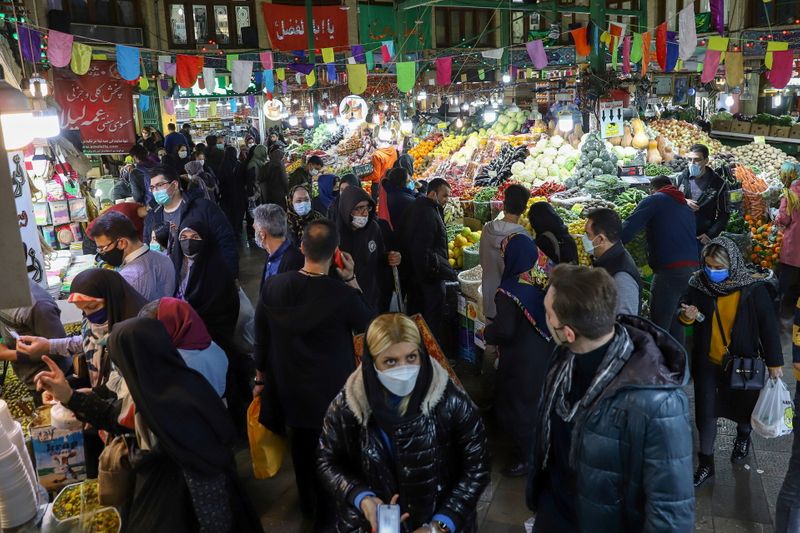 Iranians prepare to celebrate the new year, restricted by the