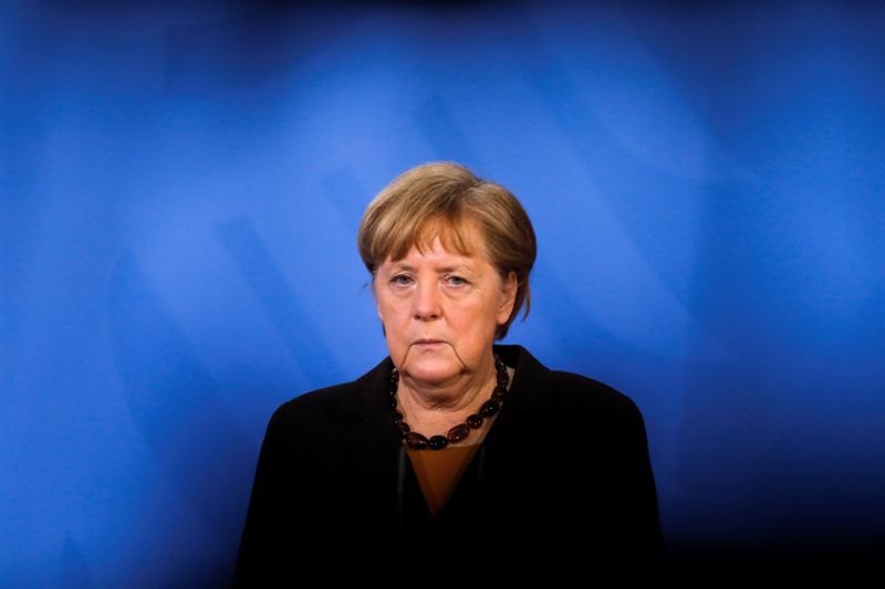 FILE PHOTO: German Chancellor Angela Merkel briefs the media after