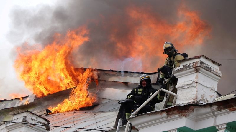 Firefighters work to extinguish a fire at a hospital in