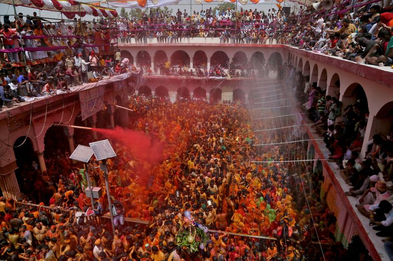 FILE PHOTO: Hindu devotees take part in ‘Huranga’, at Dauji