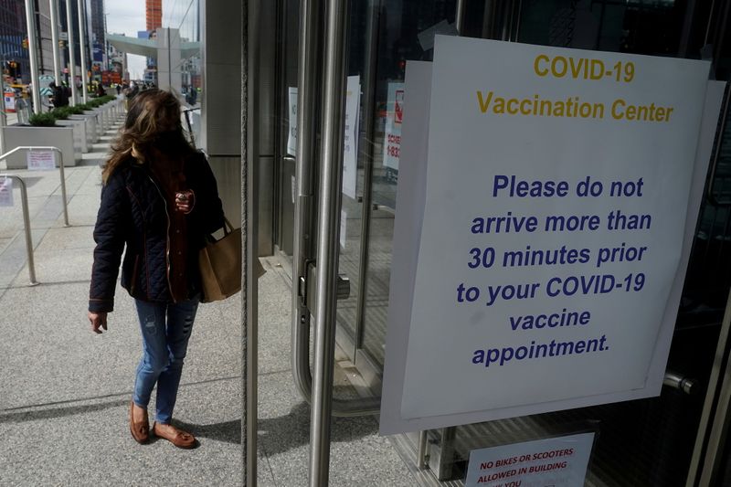 FILE PHOTO: People arrive at the Javits Center mass vaccination