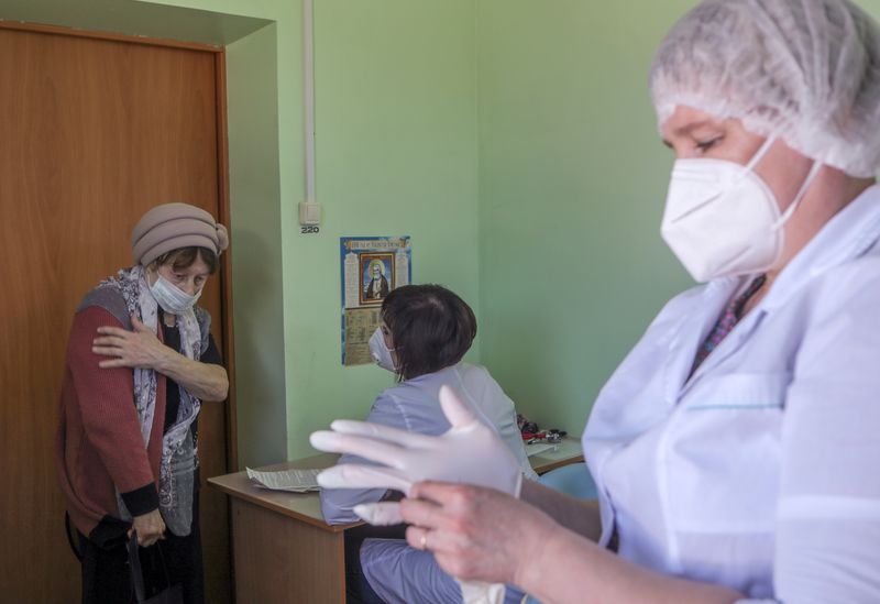 FILE PHOTO: A woman visits a local hospital to receive