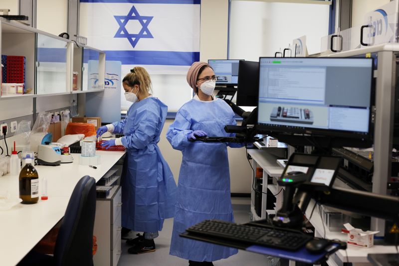 FILE PHOTO: Technicians work at Healthcare Maintenance Organization (HMO) Maccabi’s