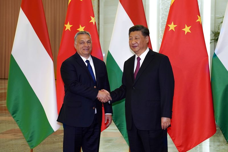 FILE PHOTO: Chinese President Xi Jinping shakes hands with Hungarian