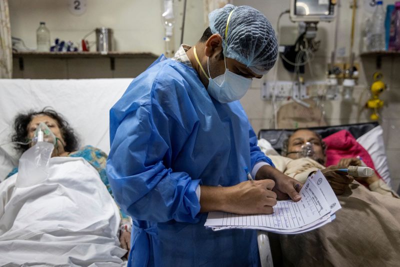 The Wider Image: As COVID ravages India, a 26-year-old doctor