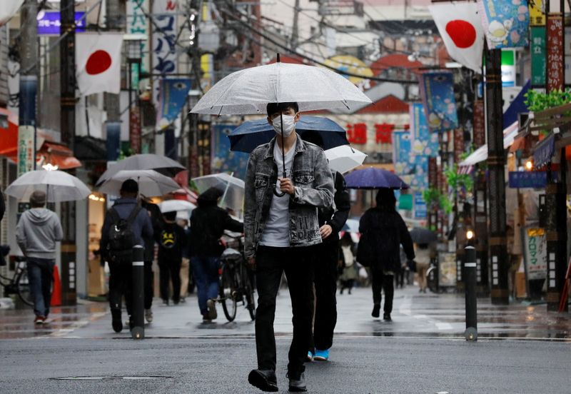 A man walks at a local shopping street in Tokyo