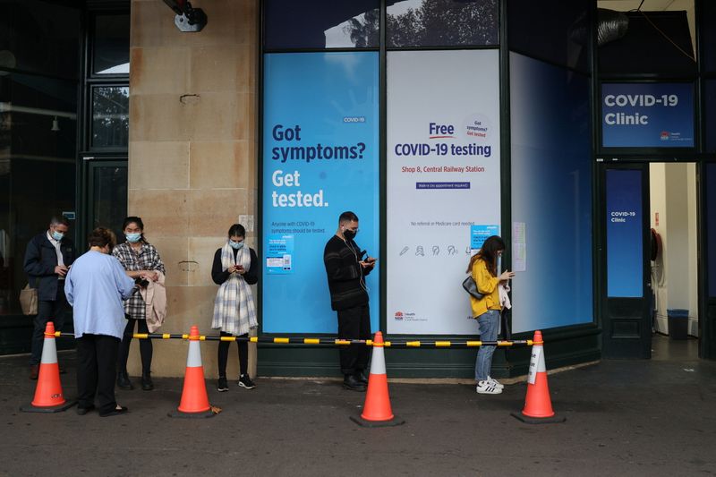 People wait in line at a coronavirus disease (COVID-19) testing