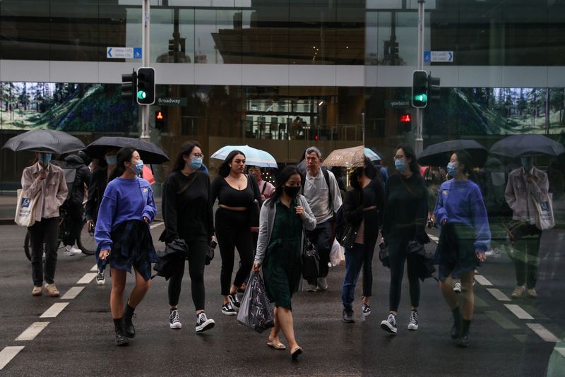 People walk through the city centre in Sydney