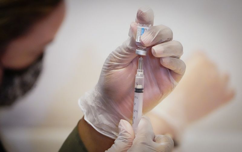 Healthcare worker prepares Johnson & Johnson vaccination dose for the