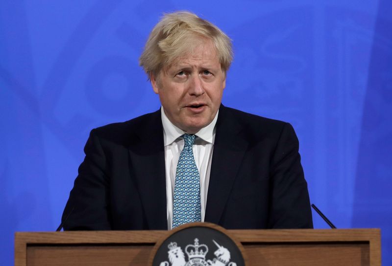 Britain’s Prime Minister Boris Johnson attends a news conference about
