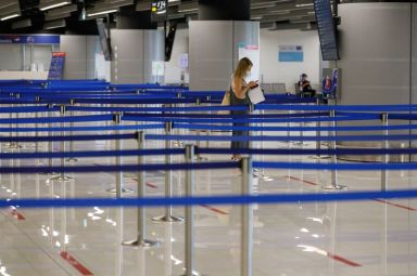 A tourist waits for check-in at Dubrovnik Airport