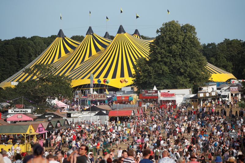 Festivalgoers enjoy the weather and stalls at Latitude Festival at