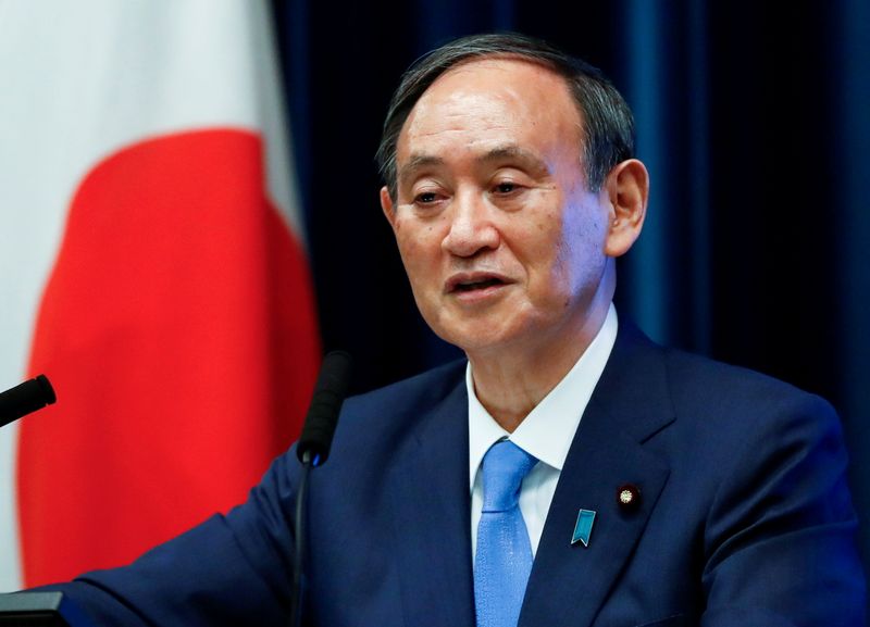 FILE PHOTO: Japan’s Prime Minister Yoshihide Suga attends a news