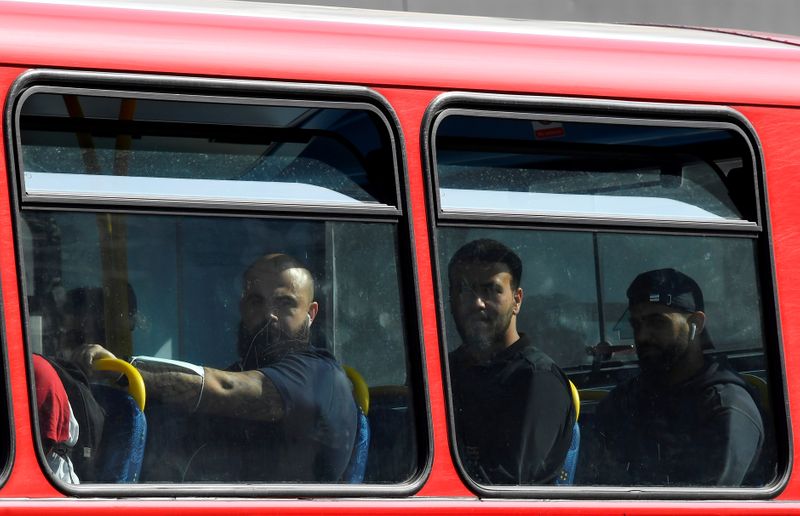 Passengers are seen on a London bus, whilst the reproduction