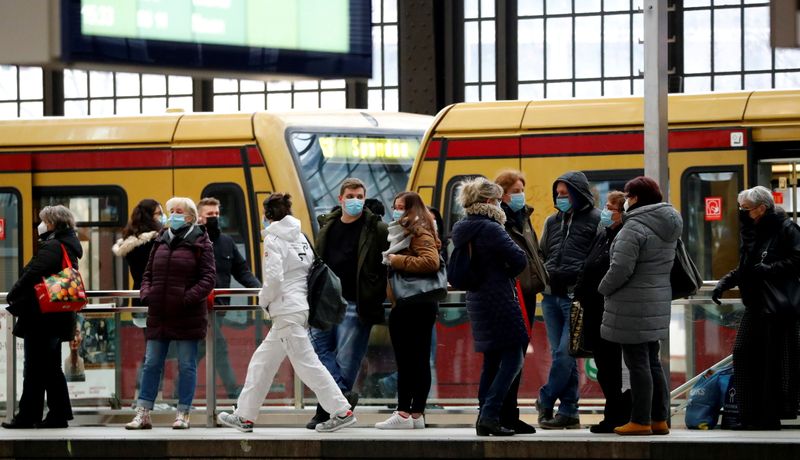 FILE PHOTO: Passengers wear face masks at Friedrichstrasse station during