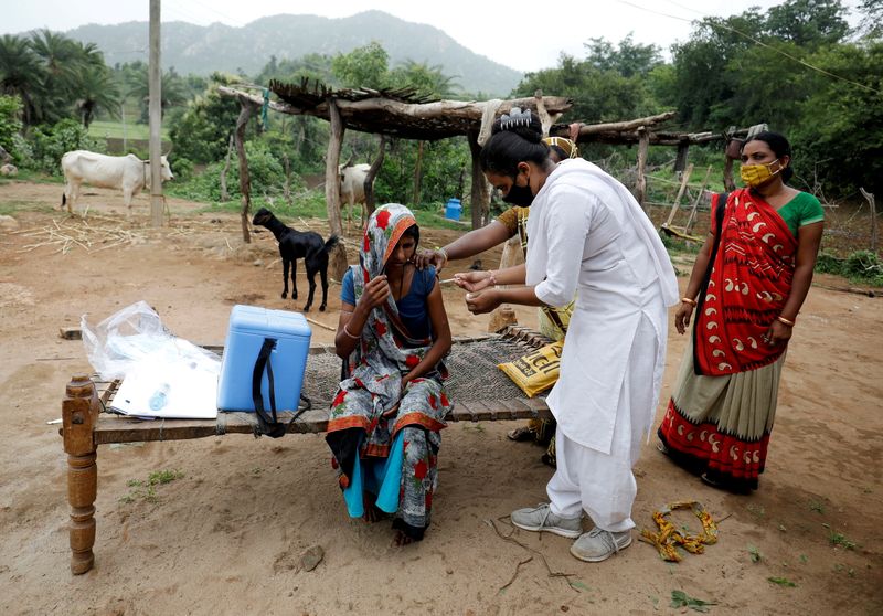 FILE PHOTO: Door-to-door vaccination drive in India’s rural Banaskantha district