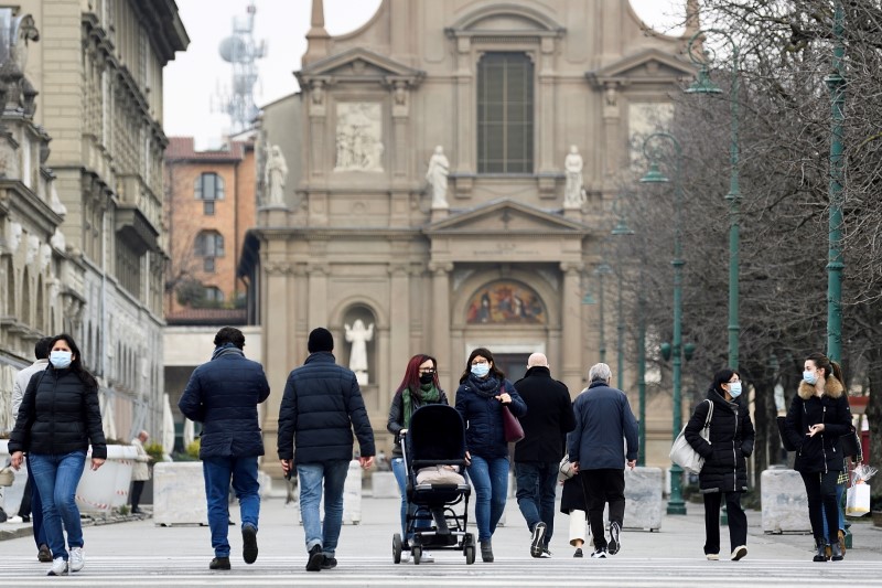 FILE PHOTO: People walking in a street in Bergamo