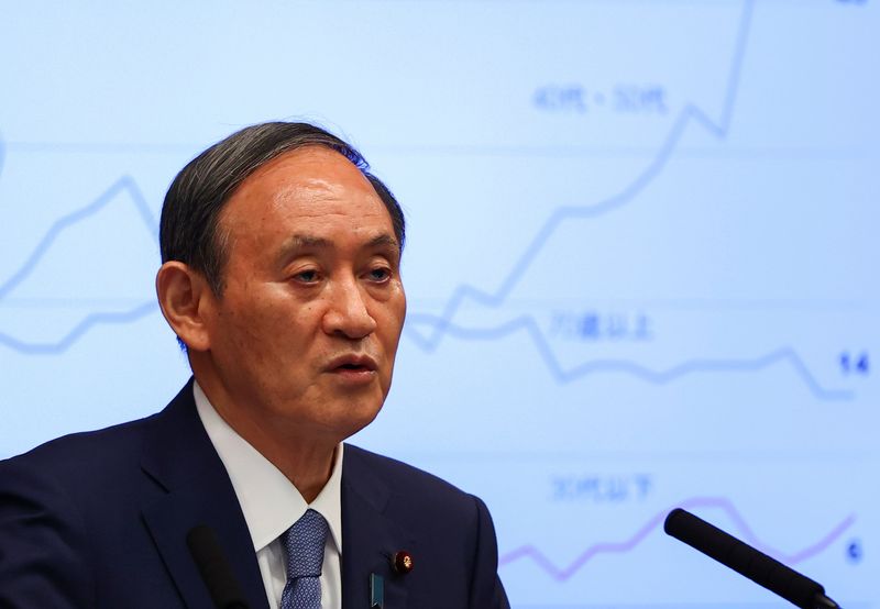 Japan’s Prime Minister Yoshihide Suga attends a news conference on