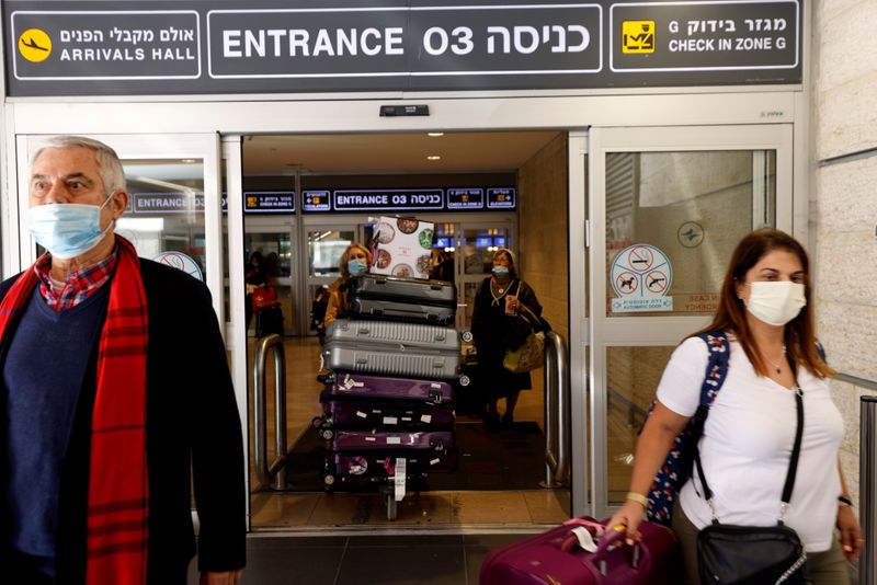 FILE PHOTO: Travellers exit Israel’s Ben Gurion International Airport, amid
