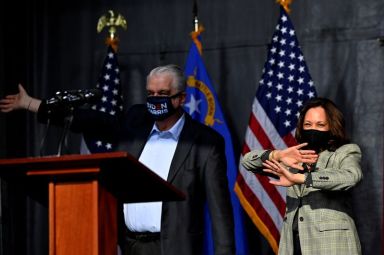 FILE PHOTO: Nevada Governor Steve Sisolak and Democratic U.S. vice