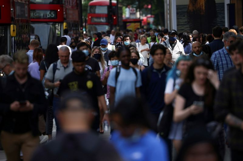 FILE PHOTO: People walk along Oxford Street, amid the coronavirus