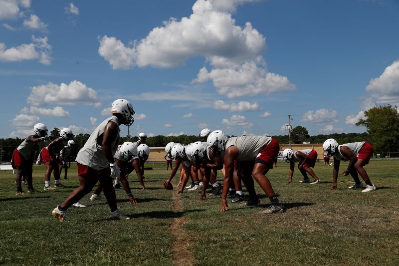 Fordyce Redbugs high school football players practice, at their home