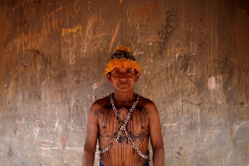 Geraldo, from Munduruku tribe poses for a picture during a
