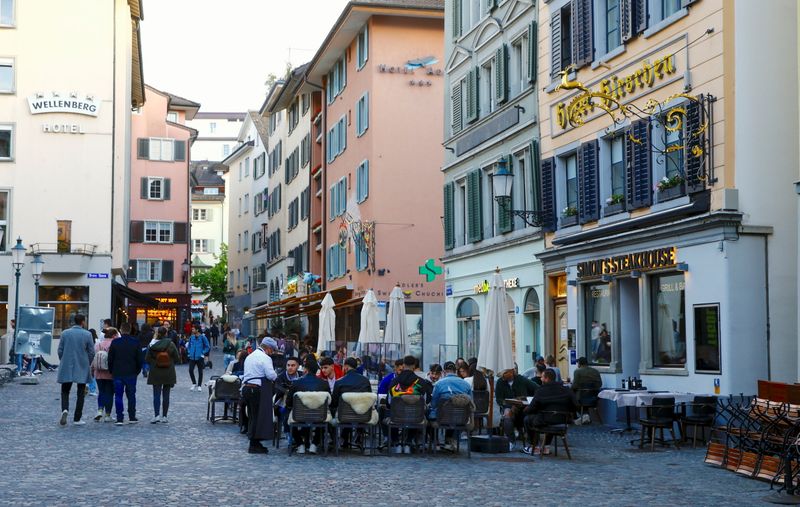 Guests sit outside of a restaurant in Zurich