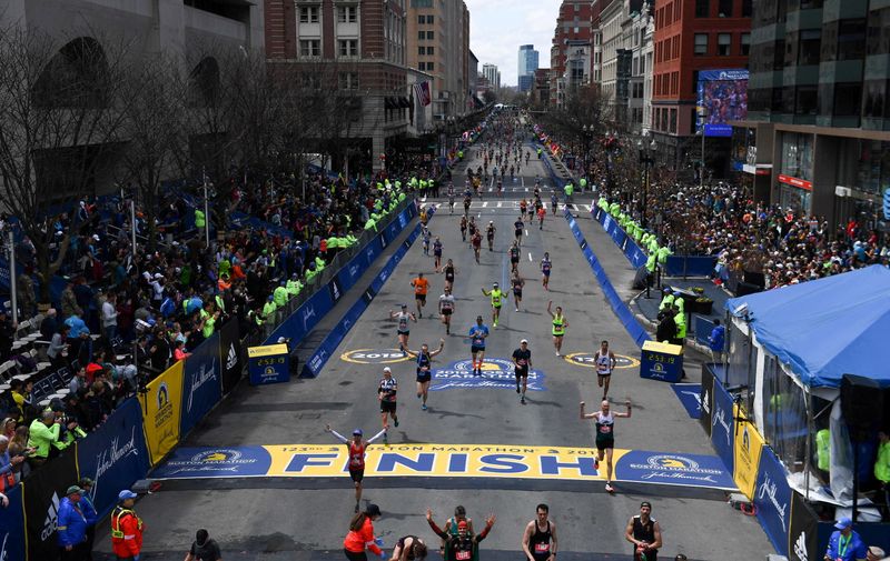 FILE PHOTO: Runners approach the finish line on Boylston Street