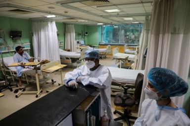 Healthcare workers are seen inside a ward for coronavirus disease