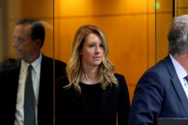 Former Theranos CEO Elizabeth Holmes leaves after a hearing at