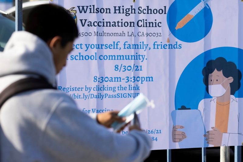 FILE PHOTO: Mobile vaccination teams begin visiting Los Angeles schools