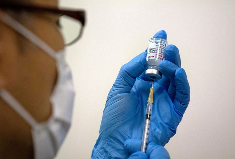 FILE PHOTO: Medical staff prepare Moderna coronavirus (COVID-19) vaccine