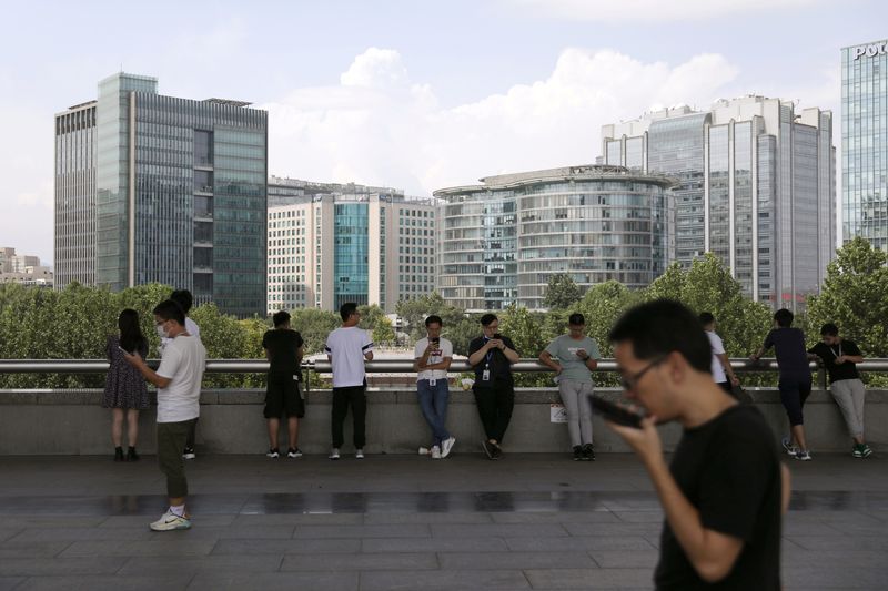 People are seen at Beijing’s tech hub Zhongguancun