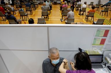 FILE PHOTO: A man receives his vaccination at a coronavirus