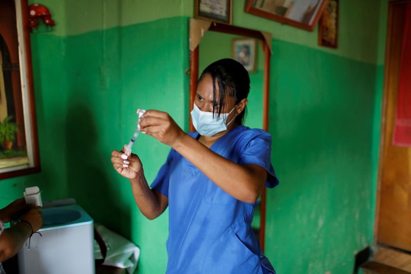 FILE PHOTO: Venezuelan healthcare workers go from door to door