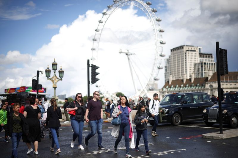 People walk over Westminster Bridge in London