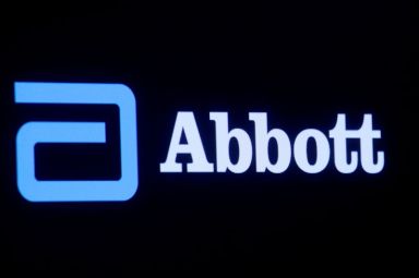 Abbott Laboratories logo is displayed on a screen at the