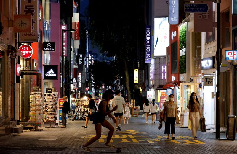 FILE PHOTO: A Seoul shopping street is pictured amid tightened