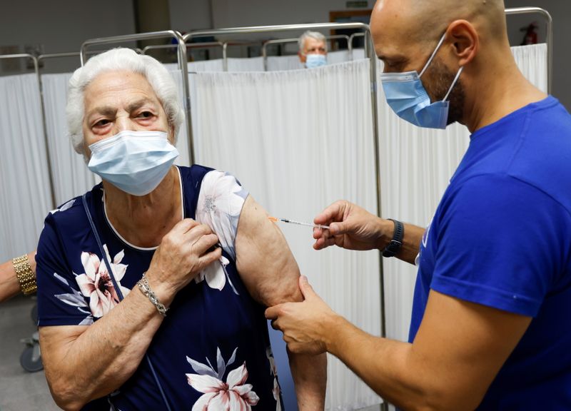 Elderly people get COVID-19  vaccine boosters in Seville