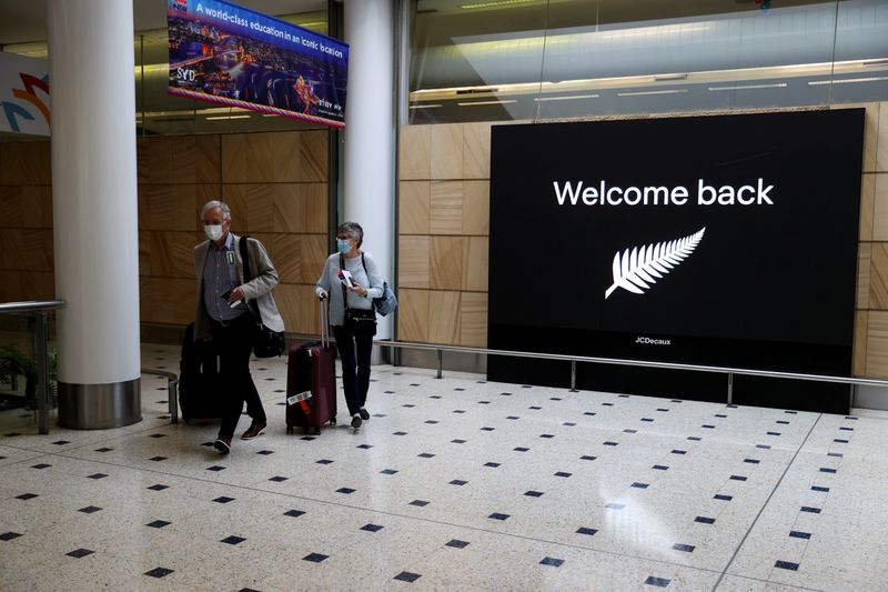 FILE PHOTO: Passengers arrive from New Zealand after the Trans-Tasman
