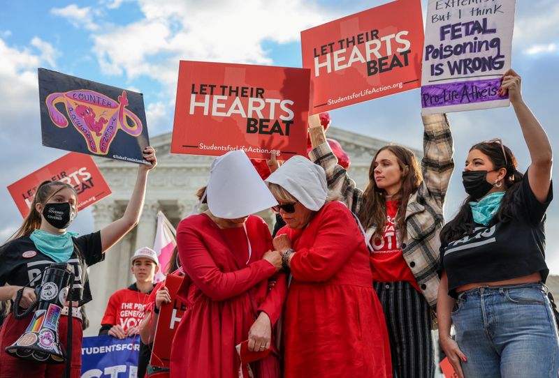 Protestors demonstrate outside U.S. Supreme Court as the court weighs