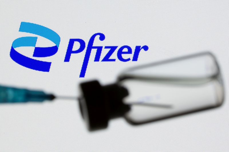 FILE PHOTO: A syringe and vial are seen in front